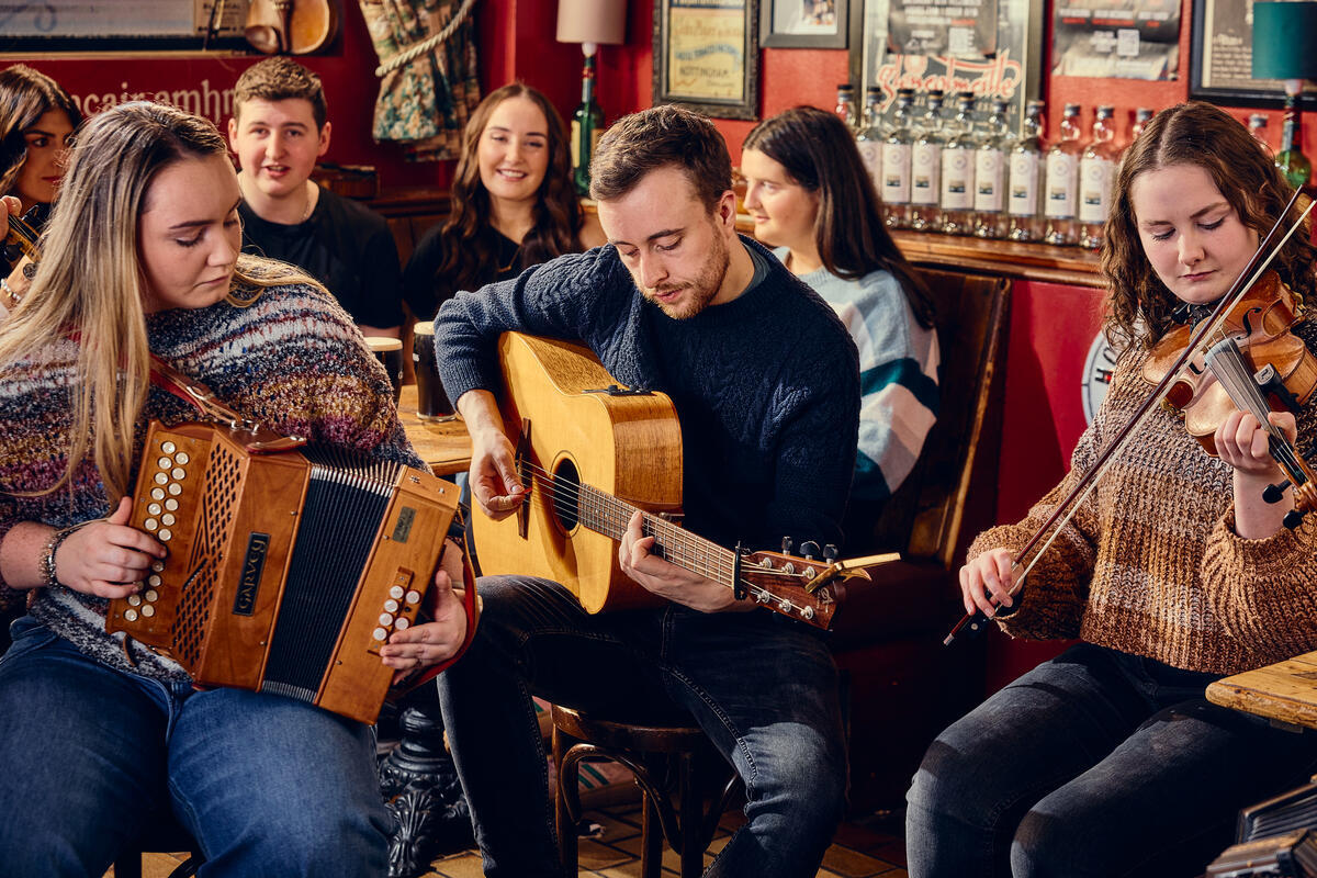 A group of musicians playing in a pub
